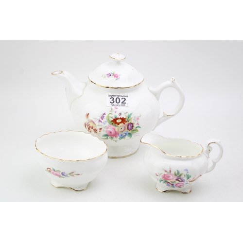 302 - Coalport tea set in the Junetime pattern to include a teapot, a milk jug and a sugar bowl (3).