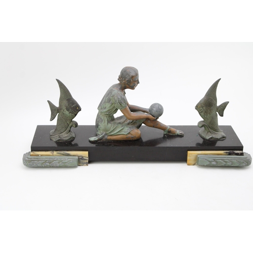 100 - An Art Deco style figure of a female with fish mounted on marble base. Height 20cm, width 45cm.