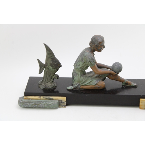 100 - An Art Deco style figure of a female with fish mounted on marble base. Height 20cm, width 45cm.