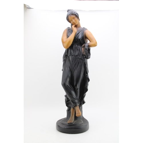 103 - A large Art Deco style figure of a lady on plinth. Height 65cm.