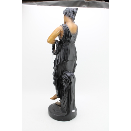 103 - A large Art Deco style figure of a lady on plinth. Height 65cm.