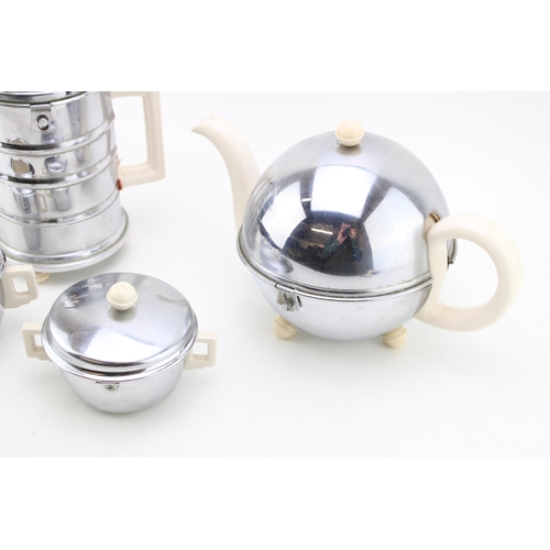 104 - A vintage ceramic and chrome metal tea and coffee set. Height 22xm.