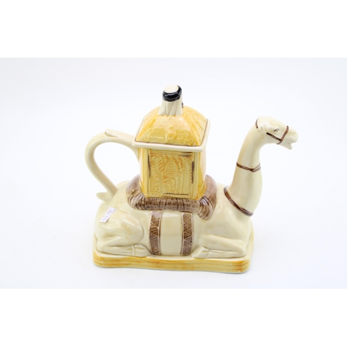 105 - A Tony Wood tea pot in the form of a Camel and Rider. Height 22cm.