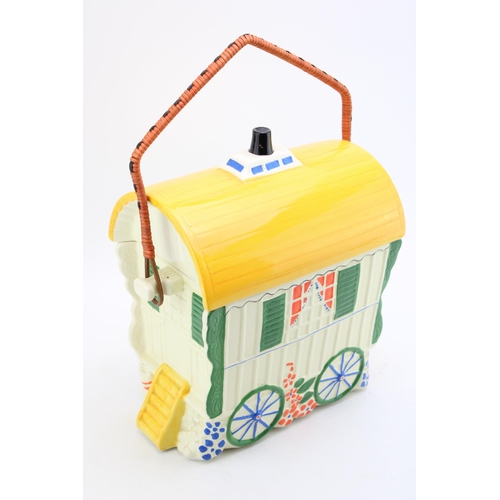 106 - An Old Romany Bone China ceramic biscuit barrel in the form of a Bow Top Caravan. Height 39cm with h... 