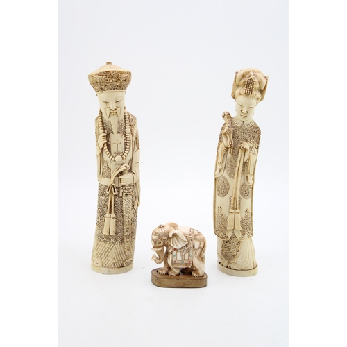 108 - A pair of faux ivory / resin figures together with an elephant mounted on wooden plinth. Height 29cm... 