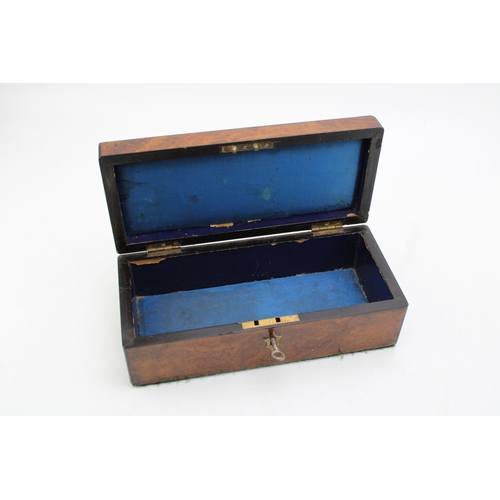 131 - Burr walnut box with brass escutcheons, working key, 25cm x 11cm x 9cm tall.