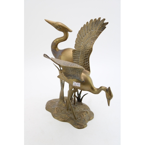 145 - A vintage brass statue of two heron / egret type birds. Height 31cm.