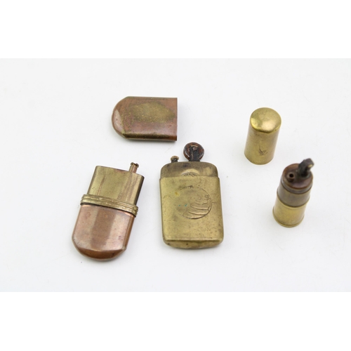 147 - A collection of vintage lighters to include trench-art style examples and a 1920s Michelin example. ... 