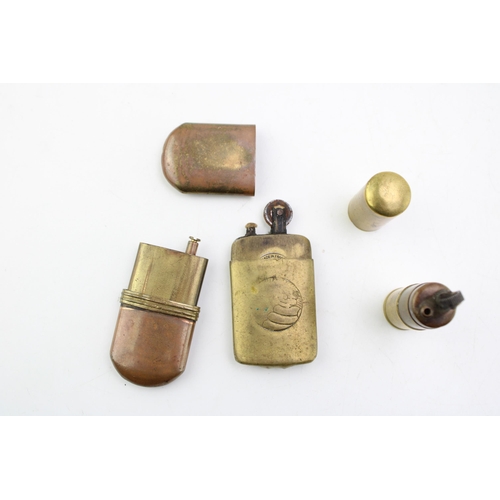 147 - A collection of vintage lighters to include trench-art style examples and a 1920s Michelin example. ... 