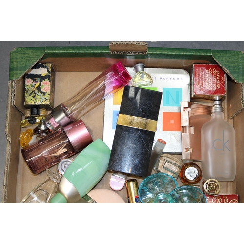 148 - A mixed collection of designer perfumes and perfumes bottles. (Qty)