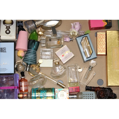 149 - A mixed collection of designer perfumes and perfumes bottles. (Qty)