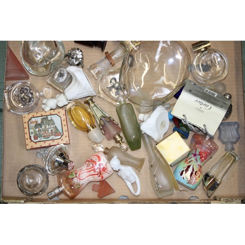 153 - A mixed collection of designer perfumes and perfumes bottles. (Qty)