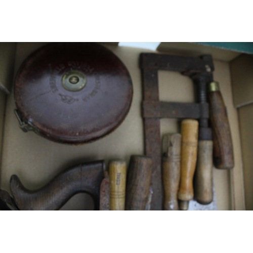 157 - A collection of vintage tools to include a Stanley plane, Sheffield chisels, Chesterman tape measure... 