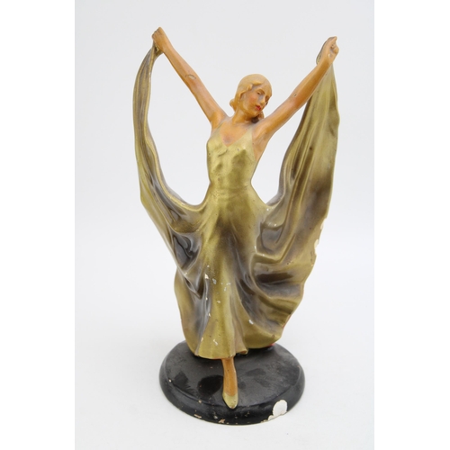 167 - An Art deco chalk ware figure of a lady. Height 32cm.