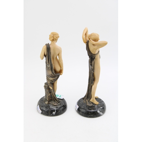 168 - A pair of nude figures in resin and metal with marble bases. Height 22cm.