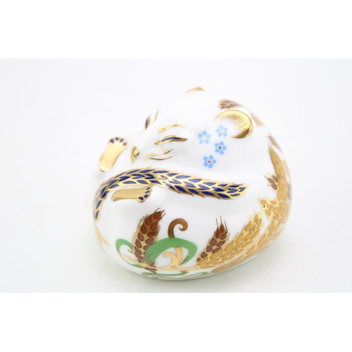 176 - A Royal Crown Derby paperweight in the form of a Sleeping Dormouse. Height 5cm.