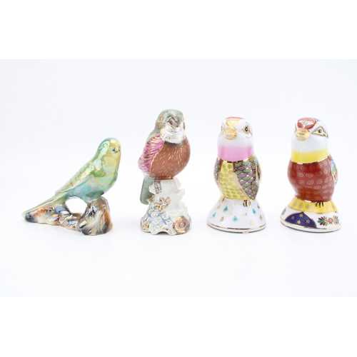 178 - A collection of ceramic birds to include two in a Royal Crown Derby style. Height 16cm. (4)