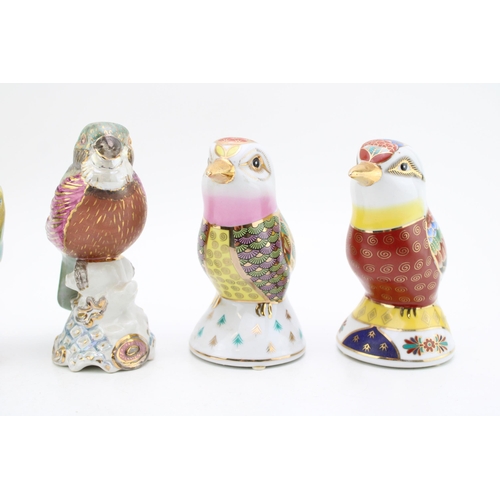 178 - A collection of ceramic birds to include two in a Royal Crown Derby style. Height 16cm. (4)