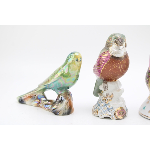 178 - A collection of ceramic birds to include two in a Royal Crown Derby style. Height 16cm. (4)