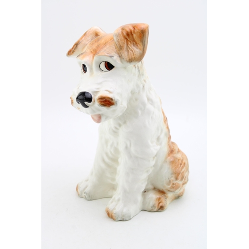 191 - Large pottery model of a dog, indistinct marks to base, 29cm tall.