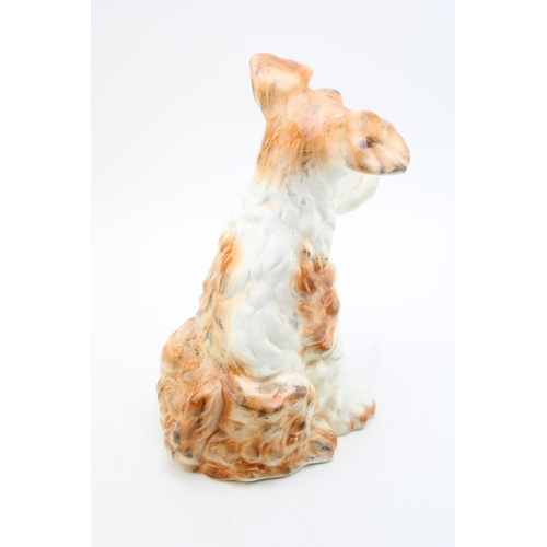 191 - Large pottery model of a dog, indistinct marks to base, 29cm tall.