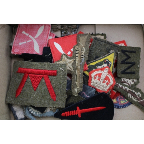 209 - A collection of patches and badges relating to the military to include Marine Commando patches, Gurk... 