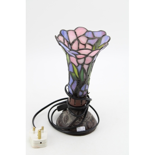 214 - A vintage Liberty Style table lamps with stained glass shade. Height 23cm.