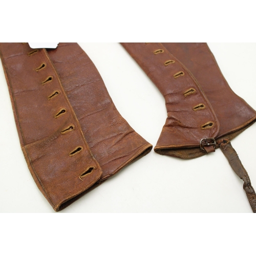 218 - A pair of antique brown leather gaiters / leggings. Length 38cm.