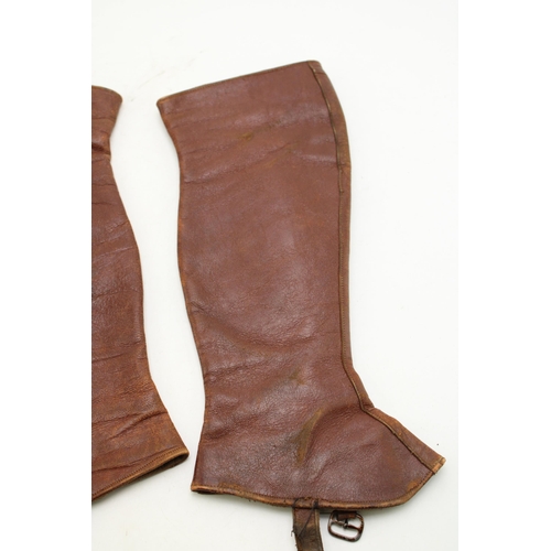 218 - A pair of antique brown leather gaiters / leggings. Length 38cm.