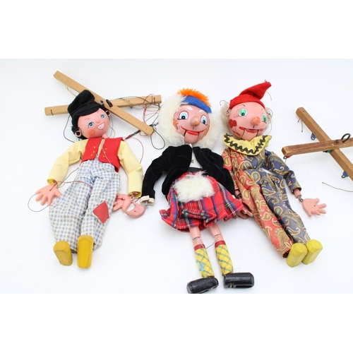 225 - A collection of Pelham Puppets to include Macboozle, Clown and Dutch Boy. (3)