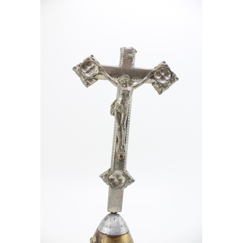 229 - Trench art model of a crucifix, marked INRI, mounted to top of a shell nose, damaged, 29cm tall.