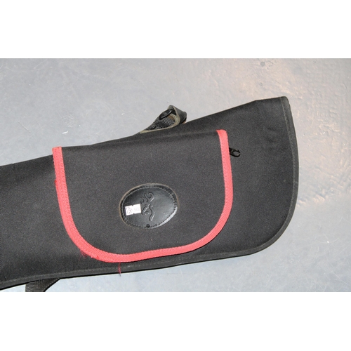 247 - A gun slip suitable for air rifle or similar. Black canvas with red piping. Length 138cm.