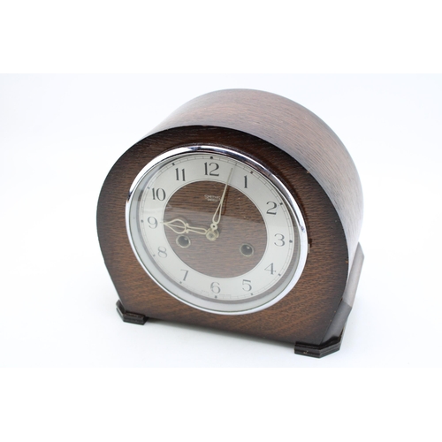 251 - A wooden cased mantle clock by Smiths, silver tone dial with Arabic numerals, home bezel, chiming mo... 