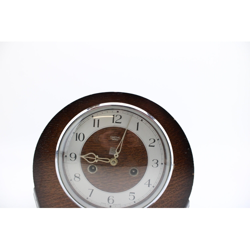 251 - A wooden cased mantle clock by Smiths, silver tone dial with Arabic numerals, home bezel, chiming mo... 