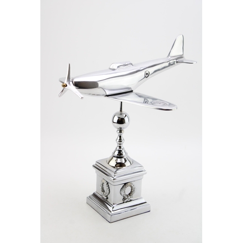 259 - A large chromed model of a Spitfire on column base. Height 35cm, width 35cm.