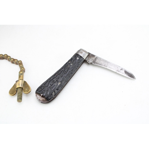 264 - Vintage Sheffield made folding pocket knife,16cm when unfolded and an antique brass novelty bottle t... 