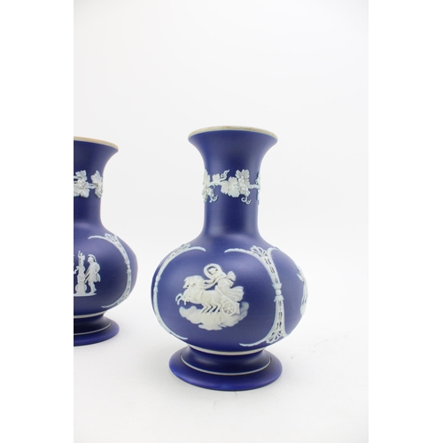 57 - A pair of Wedgwood blue dip cobalt bulbous shaped vases. Height 18cm.