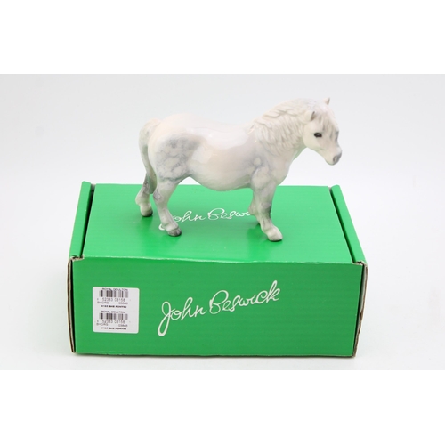 62 - Beswick Dapple Grey Shetland pony with original box. Height 13.5cm.