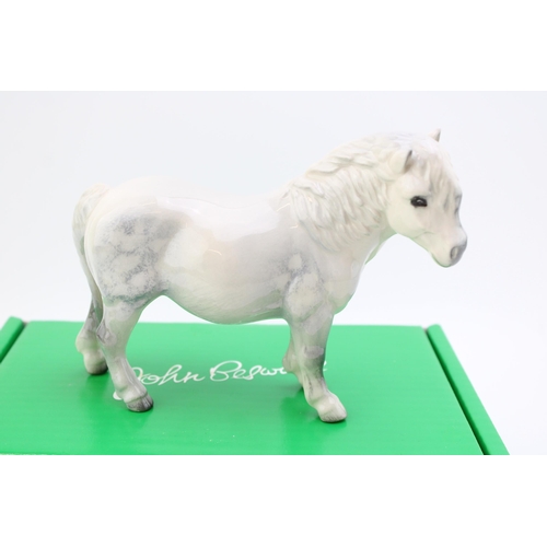 62 - Beswick Dapple Grey Shetland pony with original box. Height 13.5cm.