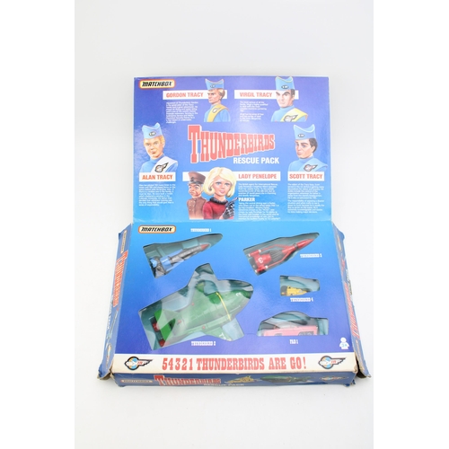 67 - A boxed Matchbox 'Thunderbirds Rescue Pack' c1992. To include TB1, TB2, TB3, TB4 and Lady Penelope's... 