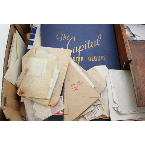 71 - A collection of vintage loose stamps and stamp albums together with a vintage wooden box. (Qty)