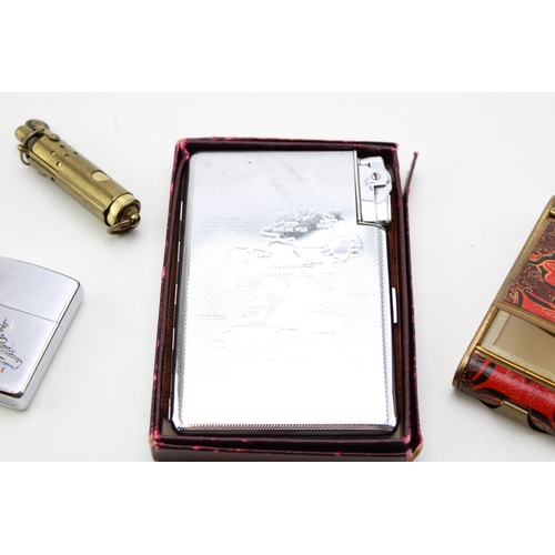 72 - A collection of smoking related items to include a cigarette case / lighter with map of Ireland / Ei... 