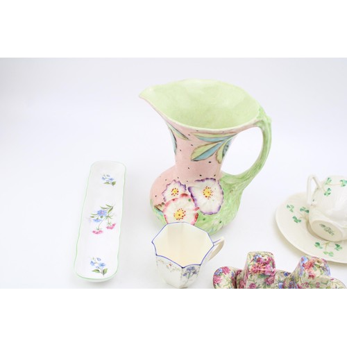 121 - A collection of ceramic items to include Beleek 'Shamrock' cup and saucer, Royal Winton 'Mayfair' cr... 