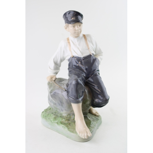 10 - Royal Copenhagen figure of a boy with a fishing rod, no. 1659, 31cm tall.