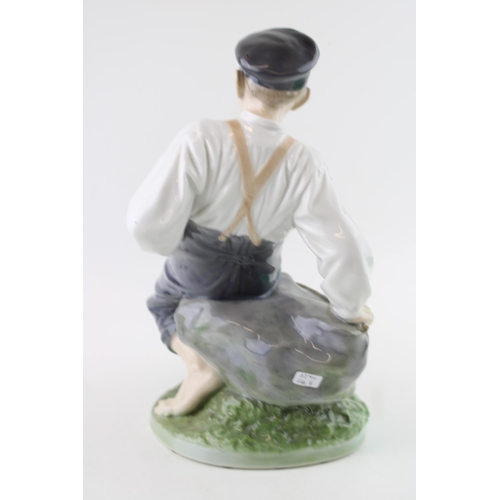 10 - Royal Copenhagen figure of a boy with a fishing rod, no. 1659, 31cm tall.