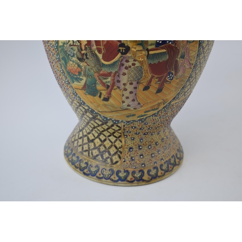 14 - Oriental two handled Satsuma-ware vase. Animal head handels with gilt decoration. Height 47cm.