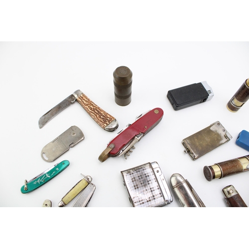 101 - A mixed collection of pocket knives, pen knives and vintage cigarette  lighters, of note Sheffield a... 