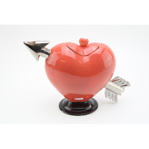 111 - A novelty teapot in the form of a heart. Height 20cm.