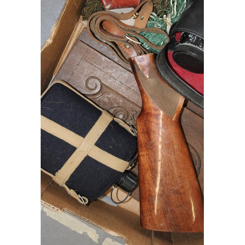 113 - A collection of shooting related items including leather 12 gauge cartridge belts, a rifle sling, gu... 