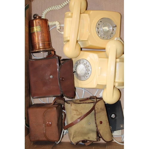 167 - Two vintage rotary dial telephones together right a copper tea measure and two box brownie type came... 